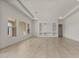 Open-concept living room featuring tile flooring, recessed lighting, and modern built-in entertainment center at 26535 W Mcrae Dr, Buckeye, AZ 85396