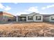 New construction home features a large backyard with dirt landscaping at 26982 W Lone Cactus Dr, Buckeye, AZ 85396