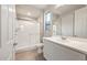 Clean bathroom featuring a glass-enclosed shower, toilet, and modern vanity at 26982 W Lone Cactus Dr, Buckeye, AZ 85396