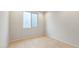 Bright bedroom with a large window and neutral finishes at 26982 W Lone Cactus Dr, Buckeye, AZ 85396