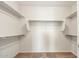 Spacious walk-in closet with carpet flooring and multiple shelves for storage at 26982 W Lone Cactus Dr, Buckeye, AZ 85396