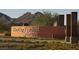 Sun City Festival community sign with flowers and mountains in the background at 26982 W Lone Cactus Dr, Buckeye, AZ 85396