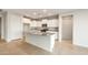 Spacious kitchen with granite countertops, stainless steel appliances, and white cabinets at 26982 W Lone Cactus Dr, Buckeye, AZ 85396