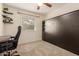 Bedroom with a Murphy bed, floating shelves, a desk, and a comfortable office chair at 280 W 23Rd Ave, Apache Junction, AZ 85120