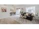 Inviting living room with a cozy sofa, neutral rug, and a dining area with a round table, ideal for relaxation and dining at 3102 E Clarendon Ave # 210, Phoenix, AZ 85016