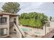 View of the community pool and hot tub, surrounded by lush landscaping at 3102 E Clarendon Ave # 210, Phoenix, AZ 85016