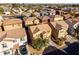 Aerial view of single-Gathering homes with tile roofs and desert landscaping in a planned community at 335 S Travis --, Mesa, AZ 85208