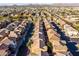 Expansive aerial view of a vibrant community with well-maintained streets and desert landscaping at 335 S Travis --, Mesa, AZ 85208