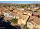 Aerial view of single-Gathering homes featuring tile roofs and desert landscape with mountain views at 335 S Travis --, Mesa, AZ 85208