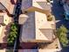 A bird's-eye view of a home with a tile roof and a patio surrounded by mature trees at 335 S Travis --, Mesa, AZ 85208