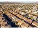 An elevated view showcases a neighborhood featuring diverse home styles and desert landscaping at 335 S Travis --, Mesa, AZ 85208