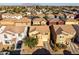 Aerial view of desert community showcasing single-Gathering homes with tile roofs and mountain backdrop at 335 S Travis --, Mesa, AZ 85208