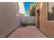 Low-maintenance backyard featuring a red-brick paver patio and block-wall fencing at 335 S Travis --, Mesa, AZ 85208