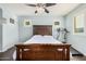 Bright bedroom features a wood-framed bed, with a treadmill for exercising offering comfort and functionality at 335 S Travis --, Mesa, AZ 85208