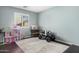 Spacious room, featuring a ride-on car and a dollhouse, providing ample room for playtime and creativity at 335 S Travis --, Mesa, AZ 85208