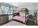 bedroom with a wooden bunk bed, Paw Patrol curtains and a rug, creating a fun and imaginative space at 335 S Travis --, Mesa, AZ 85208