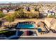 A community pool area featuring lounge chairs, a spa, and desert landscaping at 335 S Travis --, Mesa, AZ 85208