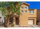 Charming two-story home featuring desert landscaping, a covered porch, and a convenient attached garage at 335 S Travis --, Mesa, AZ 85208