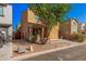 Quaint two-story home with a low-maintenance desert landscape featuring gravel and a small front porch at 335 S Travis --, Mesa, AZ 85208