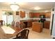 Traditional kitchen features wood cabinets, a tile backsplash, black appliances and a center island at 335 S Travis --, Mesa, AZ 85208