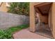 Covered patio with red-brick paver flooring and block-wall fencing at 335 S Travis --, Mesa, AZ 85208
