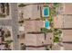 An aerial view of homes in a neighborhood, one featuring a backyard pool, patio, and desert landscaping at 346 E Red Mesa Trl, San Tan Valley, AZ 85143