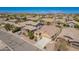 Aerial view of a beige single-Gathering home with a tile roof in a planned community at 346 E Red Mesa Trl, San Tan Valley, AZ 85143