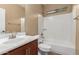 Bathroom featuring neutral colors, sink, cabinets, vanity mirror, and shower-tub combination at 346 E Red Mesa Trl, San Tan Valley, AZ 85143