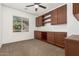 Bright office with a large window and built-in custom cabinetry and desk at 346 E Red Mesa Trl, San Tan Valley, AZ 85143