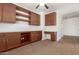 Spacious office featuring custom built-in cabinets, desk, and neutral carpeting at 346 E Red Mesa Trl, San Tan Valley, AZ 85143