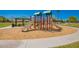 A new modern playground with shade cover and a picnic table on a mulch base in a community park at 346 E Red Mesa Trl, San Tan Valley, AZ 85143