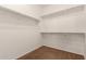 Bright walk-in closet featuring neutral colors, shelves, and plush carpet flooring at 346 E Red Mesa Trl, San Tan Valley, AZ 85143