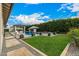 Expansive backyard featuring a sparkling pool, lush lawn, stylish water features, and a charming pavilion at 3483 E Bloomfield Pkwy, Gilbert, AZ 85296