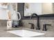 Modern bathroom sink features black faucet, granite counters, and stylish decorative vases at 3483 E Bloomfield Pkwy, Gilbert, AZ 85296