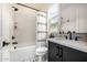 Contemporary bathroom showcasing black fixtures, a shower, and stylish tile flooring at 3483 E Bloomfield Pkwy, Gilbert, AZ 85296