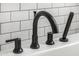 Modern bathtub faucet features elegant black fixtures with handheld shower head at 3483 E Bloomfield Pkwy, Gilbert, AZ 85296