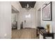 Bright foyer featuring wood floors, stylish lighting, and decorative accents at 3483 E Bloomfield Pkwy, Gilbert, AZ 85296