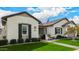 Charming home with lush lawn, landscaped garden beds, and stone walkway at 3483 E Bloomfield Pkwy, Gilbert, AZ 85296