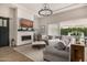 Bright living room features a stylish fireplace and a comfortable sectional sofa at 3483 E Bloomfield Pkwy, Gilbert, AZ 85296
