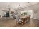 Open-concept living and dining area with stylish furniture and a sliding barn door at 3483 E Bloomfield Pkwy, Gilbert, AZ 85296
