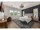 Well-lit main bedroom with plush bedding, decorative rug, and modern decor at 3483 E Bloomfield Pkwy, Gilbert, AZ 85296