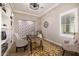 Cozy home office with custom built-ins, natural light, and comfortable seating at 3483 E Bloomfield Pkwy, Gilbert, AZ 85296