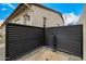 This outdoor shower features a black corrugated metal surround, tile base and small gray gravel at 3483 E Bloomfield Pkwy, Gilbert, AZ 85296