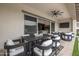 Inviting covered patio offering a dining table, comfortable seating, and an indoor/outdoor feel at 3483 E Bloomfield Pkwy, Gilbert, AZ 85296