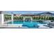 Beautiful pool with an integrated spa, waterfall feature, and in-pool seating, enhancing the outdoor living experience at 3483 E Bloomfield Pkwy, Gilbert, AZ 85296