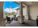 Cozy front porch showcasing chairs and a table, all designed to create an inviting outdoor living space at 3483 E Bloomfield Pkwy, Gilbert, AZ 85296