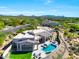 Panoramic aerial view of a desert home with a pool, outdoor living space, and landscaped yard at 35348 N 87Th St, Scottsdale, AZ 85266