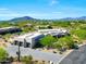 Desert estate with a neutral color scheme, mature landscaping, four car garage, and mountain views at 35348 N 87Th St, Scottsdale, AZ 85266