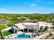 Expansive aerial view showcases a modern home with a private pool, spa, and lush desert landscaping at 35348 N 87Th St, Scottsdale, AZ 85266