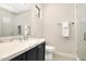 Elegant bathroom with quartz countertops, modern vanity and lighting, and a glass-enclosed shower at 35348 N 87Th St, Scottsdale, AZ 85266